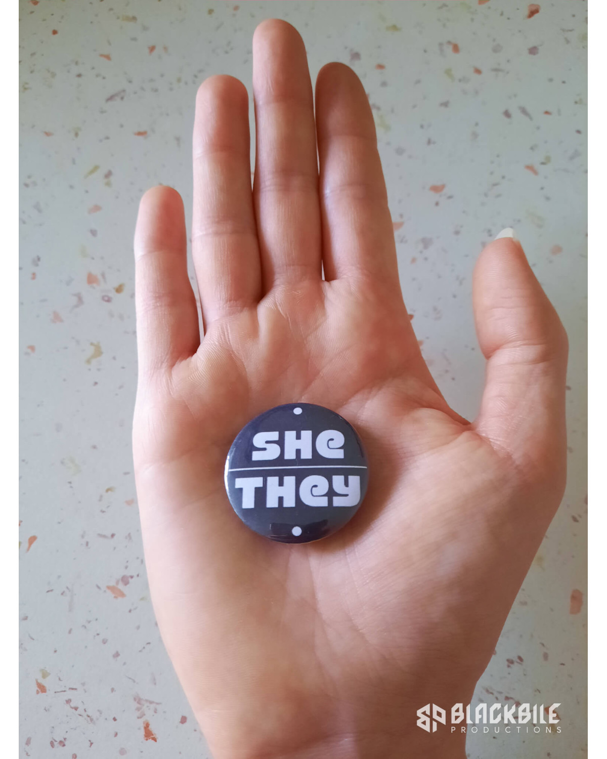 Small button badge She They pronouns