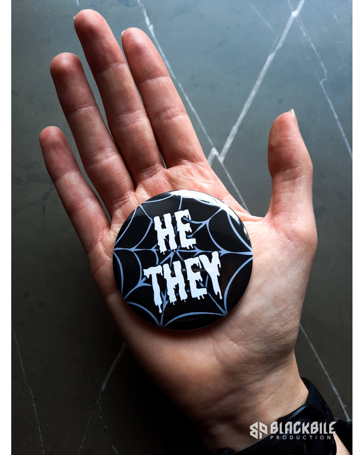 Big button badge He They pronouns spider web